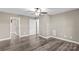 Bedroom featuring hardwood floors, ceiling fan, and a door that leads to another room at 270 Yachtsman Dr, Salisbury, NC 28146