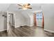 Open bedroom featuring hardwood floors, a ceiling fan and light fixture, vaulted ceiling, and a large window with lake views at 270 Yachtsman Dr, Salisbury, NC 28146