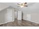 A spacious bedroom featuring hardwood floors, a ceiling fan and light fixture, and multiple closets and entryways at 270 Yachtsman Dr, Salisbury, NC 28146