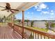 Stunning view from the wood deck overlooking the lake, dock, and landscaped backyard of this waterfront property at 270 Yachtsman Dr, Salisbury, NC 28146