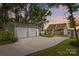 Charming home featuring a detached two-car garage, a covered carport, and lush landscaping at 270 Yachtsman Dr, Salisbury, NC 28146