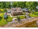 Beautiful waterfront home with a well-manicured lawn, fire pit, and private gazebo for outdoor enjoyment at 270 Yachtsman Dr, Salisbury, NC 28146