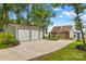Charming home featuring a detached two-car garage, a covered carport, and lush landscaping at 270 Yachtsman Dr, Salisbury, NC 28146
