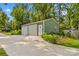 Spacious detached garage with ample storage space and a concrete driveway for convenient parking at 270 Yachtsman Dr, Salisbury, NC 28146