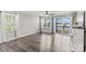 Open living room featuring hardwood floors, large windows, and glass doors with deck access at 270 Yachtsman Dr, Salisbury, NC 28146
