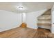 Finished basement features wood-look floors, shelving, and neutral walls at 3090 Goblet Rd, Richburg, SC 29729