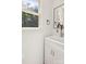Bright bathroom with white vanity and view out the window to the trees at 3090 Goblet Rd, Richburg, SC 29729