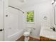 Well-lit bathroom featuring a shower-tub combo, toilet, vanity, and window at 3090 Goblet Rd, Richburg, SC 29729