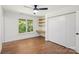Cozy bedroom featuring hardwood floors, window, and a closet with sliding doors at 3090 Goblet Rd, Richburg, SC 29729