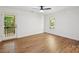 Bright bedroom with wood-look floors, ceiling fan, and glass patio doors to the outside at 3090 Goblet Rd, Richburg, SC 29729