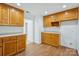 Bright kitchen featuring wooden cabinets, laminate countertops, and wood-look flooring at 3090 Goblet Rd, Richburg, SC 29729