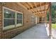 Covered patio showcasing brick construction and outdoor living space at 3090 Goblet Rd, Richburg, SC 29729