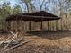 Secluded rustic pavilion surrounded by bare trees and autumn leaves offers a tranquil outdoor space at 3090 Goblet Rd, Richburg, SC 29729