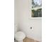 This bathroom has a standard toilet and a window with view of the trees and sky at 3090 Goblet Rd, Richburg, SC 29729