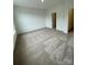 Open primary bedroom with multiple windows and fresh paint at 353 Jetton St, Davidson, NC 28036