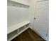 Functional entryway with bench seating, coat hooks, and durable vinyl floors at 353 Jetton St, Davidson, NC 28036
