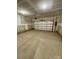 Spacious two car garage featuring ample room for parking and storage, enhancing functionality and convenience at 353 Jetton St, Davidson, NC 28036