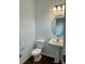 Cozy half bath with updated fixtures and pedestal sink at 353 Jetton St, Davidson, NC 28036