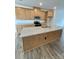 Modern kitchen featuring a center island, granite countertops, and stainless steel appliances at 353 Jetton St, Davidson, NC 28036