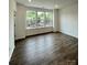 Bright living room with lots of natural light and beautiful hardwood floors at 353 Jetton St, Davidson, NC 28036