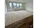 Spacious living room features multiple windows and door for ample natural light at 353 Jetton St, Davidson, NC 28036
