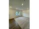 Inviting living room boasting cozy carpet flooring and natural light from surrounding windows at 353 Jetton St, Davidson, NC 28036