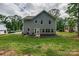 A large backyard features a small patio with outdoor seating at 360 Sundown Rd, Mooresville, NC 28117
