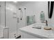 Bright bathroom with white subway tile shower, glass door, and marble countertop vanity at 360 Sundown Rd, Mooresville, NC 28117