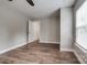 Bedroom featuring wood-look floors, neutral walls, and access to a closet at 360 Sundown Rd, Mooresville, NC 28117
