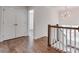 Upstairs hallway with hardwood floors and closet at 360 Sundown Rd, Mooresville, NC 28117