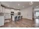 Well-equipped kitchen features stainless steel appliances, white cabinets, and island seating at 360 Sundown Rd, Mooresville, NC 28117