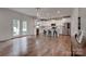 Modern kitchen with stainless steel appliances, white cabinets, and center island at 360 Sundown Rd, Mooresville, NC 28117