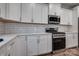 Modern kitchen with white cabinets, stainless steel appliances, and granite countertops at 360 Sundown Rd, Mooresville, NC 28117