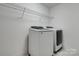 A well-organized laundry room with modern washer and dryer at 360 Sundown Rd, Mooresville, NC 28117