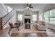 Bright living room with fireplace, large windows, and open floor plan at 360 Sundown Rd, Mooresville, NC 28117
