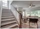 Inviting living room features a fireplace, staircase, and abundant natural light at 360 Sundown Rd, Mooresville, NC 28117