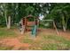 Wooden playground with slide and swingset surrounded by mature trees at 360 Sundown Rd, Mooresville, NC 28117