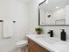 Stylish half-bathroom features a modern vanity, sleek black fixtures and white walls at 3801 Rea Rd, Charlotte, NC 28226