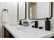 Bathroom double sink featuring black hardware and matte white countertop at 3801 Rea Rd, Charlotte, NC 28226