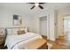 Bright bedroom with a ceiling fan, closet, and view into the hallway at 3801 Rea Rd, Charlotte, NC 28226