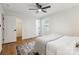 Bright bedroom with window, closet, ceiling fan, and wooden floors at 3801 Rea Rd, Charlotte, NC 28226