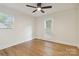 This bedroom features hardwood floors, natural light, and neutral walls at 3801 Rea Rd, Charlotte, NC 28226