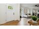 Welcoming foyer leading to a bright living room with hardwood floors and neutral décor at 3801 Rea Rd, Charlotte, NC 28226