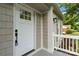 Elegant front door with glass panels, classic black hardware, and stylish exterior trim at 3801 Rea Rd, Charlotte, NC 28226
