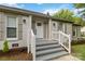 Inviting front porch with decorative columns and detailed trim surrounding the main entrance at 3801 Rea Rd, Charlotte, NC 28226