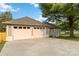 Spacious two-car garage with white doors and exterior detailing, providing ample parking and storage at 3801 Rea Rd, Charlotte, NC 28226