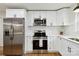 Bright kitchen with white cabinetry, stainless steel appliances, and subway tile backsplash at 3801 Rea Rd, Charlotte, NC 28226