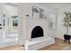 Bright living room with white painted brick fireplace and access to a sunroom at 3801 Rea Rd, Charlotte, NC 28226