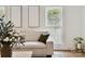 Inviting living room with a cozy sofa, and natural light through the window at 3801 Rea Rd, Charlotte, NC 28226