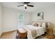 Cozy bedroom with a comfortable bed, soft lighting, and natural decor accents at 3801 Rea Rd, Charlotte, NC 28226